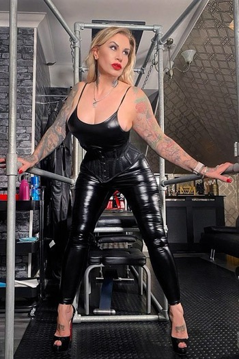 Mistress Ava Von Medsin, the femme-fatale disciplinarian, on The English Mansion presented by Femdom Magazine